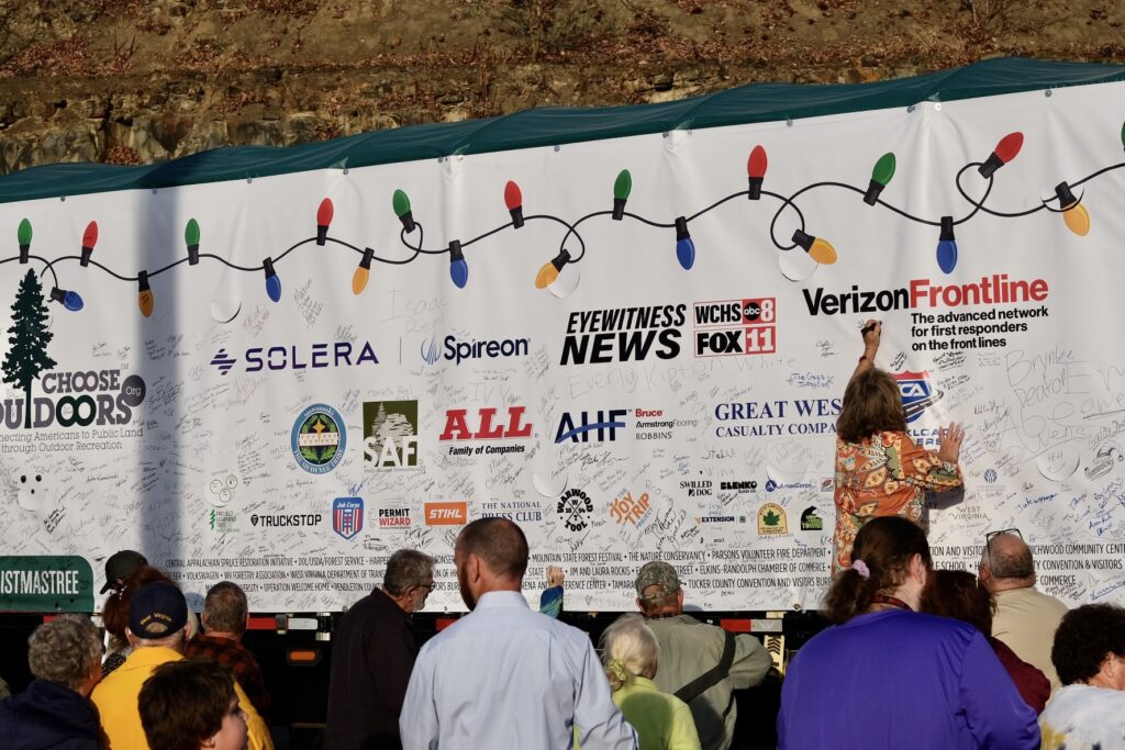 People gathering in Marlinton to write a message on the Capitol Christmas Tree