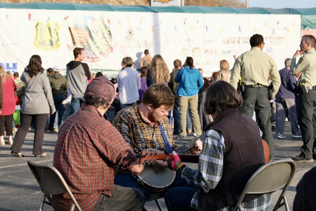 Musicians playing music in front of Capitol Christmas Tree event in Marlinton
