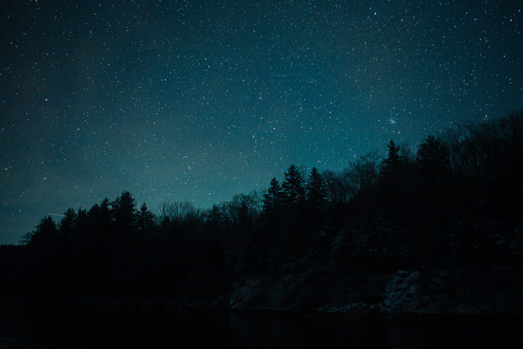 Photo of Dark Night Sky with Stars in the Mon