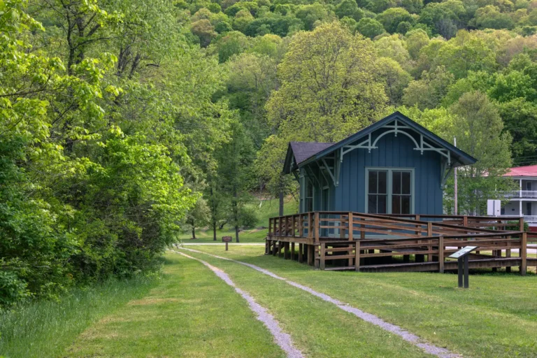 Wooden blue train depot along rail trail