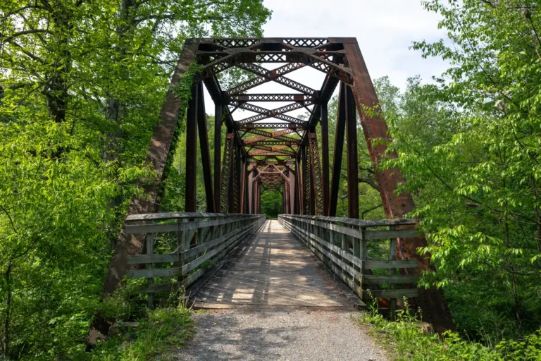 steel and wooden railroad trestle along rail trail