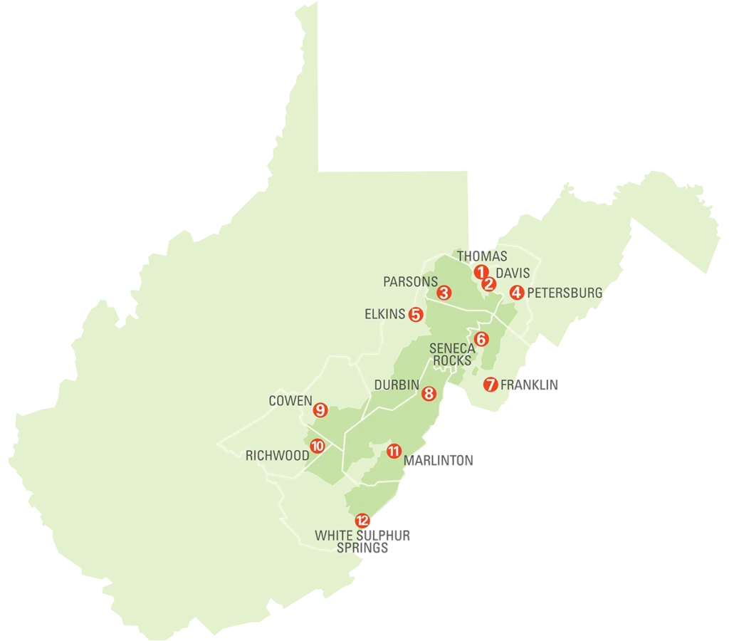 Green WV county map with white boundary lines and 12 red numbered markers indicating locations (e.g., Thomas, Davis, Petersburg, Elkins, Parsons, Durbin, Seneca Rocks, Cowen, Richwood, White Sulphur Springs)